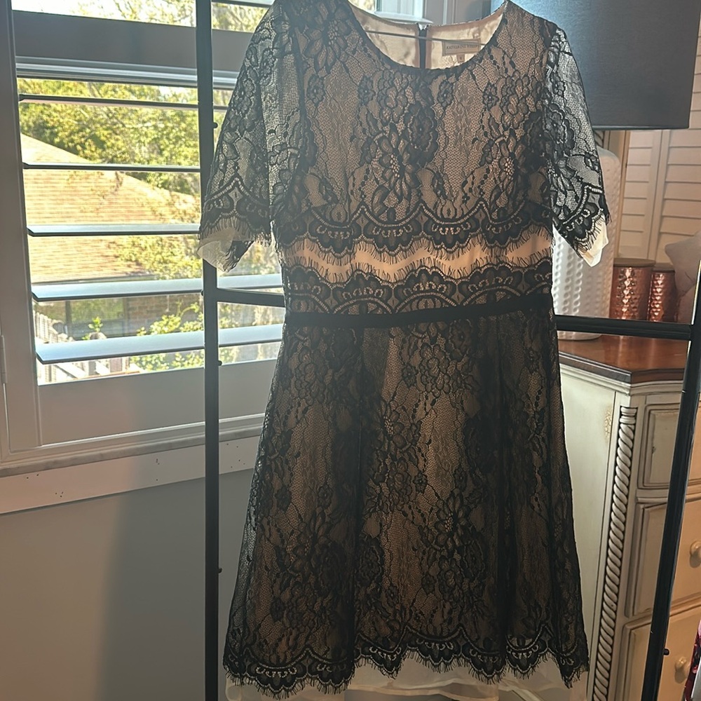 Black with cream, beautiful lace dress in a size 8 medium.